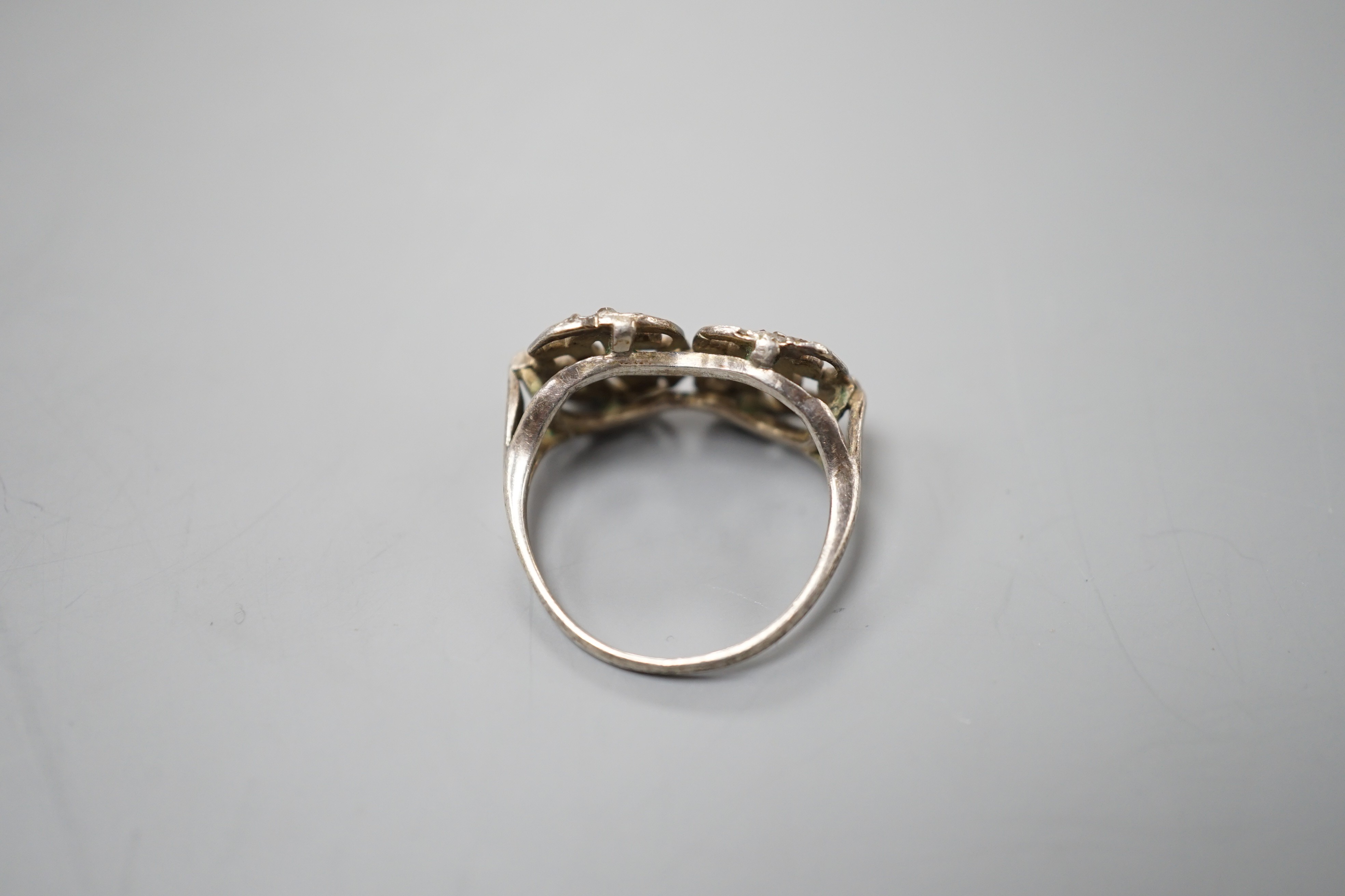 A 19th century white metal and rose cut diamond chip set monogram? ring, size L, gross weight 3 grams.